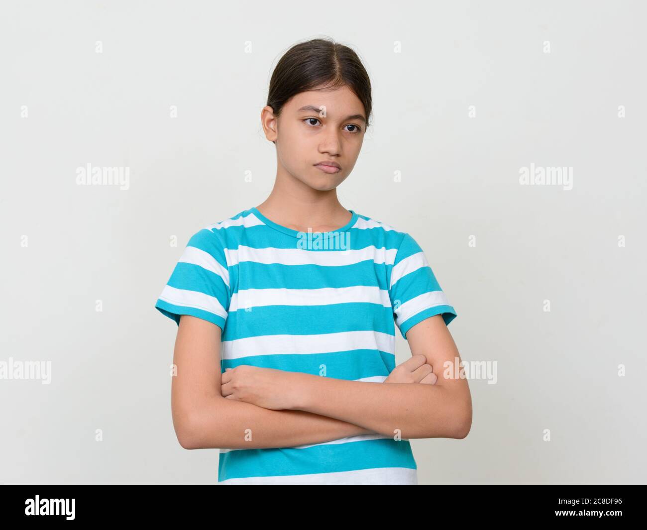 Portrait of young Asian teenage girl against white background Stock ...