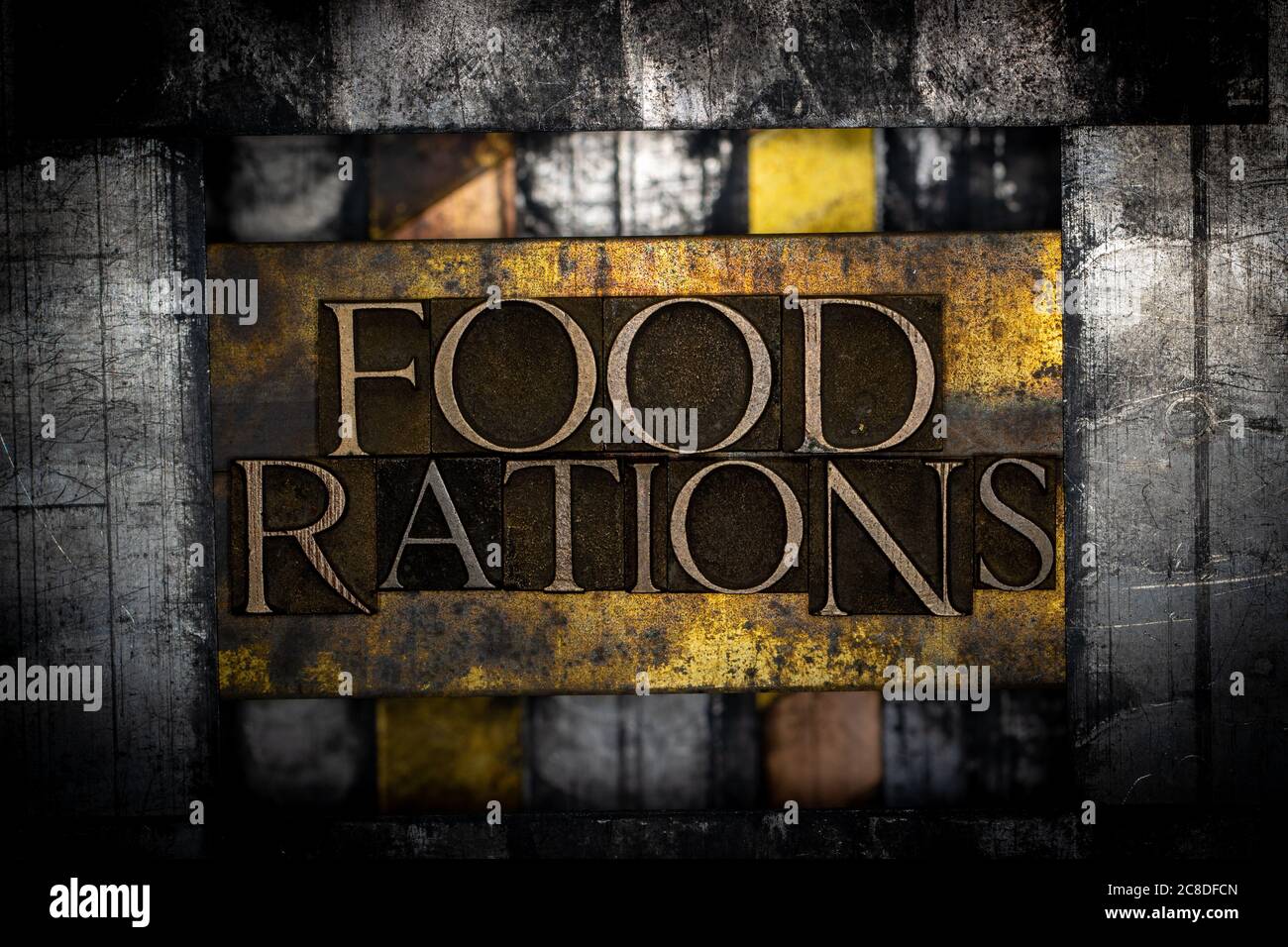 Food Rations text formed with real authentic typeset letters on vintage textured silver grunge copper and gold background Stock Photo