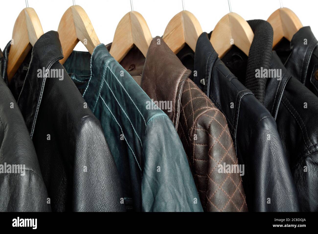 collection of leather jackets on hangers Stock Photo