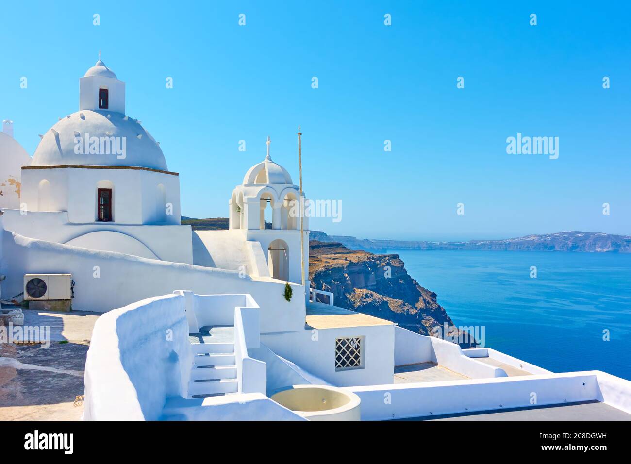 View with greek orthodox church in Fira town in Santorini island, Greece.  Greek scenery Stock Photo