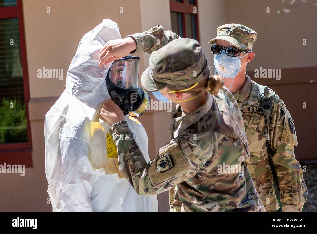 Colorado National Guard members of the Chemical, Biological, Radiological, Nuclear and high-yield (CBRNE) Enhanced Response Force Package (CERFP) team member, processes through the decontamination station after performing COVID-19 testing at a state veterans home in Aurora, Colorado, April 29, 2020. At the direction of Governor Jared Polis, the Colorado CERFP is assisting the state emergency operations center and Colorado Department of Public Health and Environment increase testing procedures and enabling state and local officials with an increased capability where needed.  (U.S. Air National Stock Photo