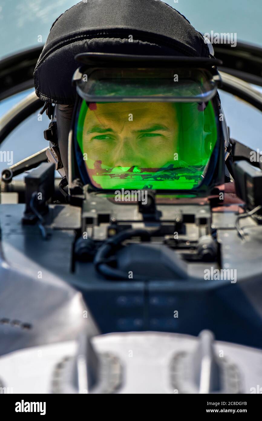 U.S. Air Force 1st Lt. T.J. Copic, an F-16 fighter pilot assigned to the Ohio National Guard’s 180th Fighter Wing, prepares for a training flight in an F-16 Fighting Falcon at the 180FW in Swanton, Ohio, June 30, 2020. The 180FW is the only F-16 fighter wing in the state of Ohio, whose mission is to provide for America; protection of the homeland, effective combat power and defense support to civil authorities, while developing Airmen, supporting their families and serving in our community. (U.S. Air National Guard photo by Senior Airman Kregg York) Stock Photo