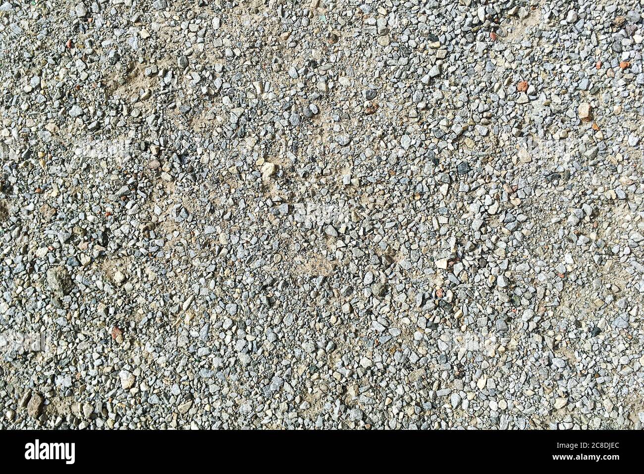 Decorative crushed gray pieces fine  gravel stones for construction industry. Stones background. Top view. Abstract texture. Background for design. Cl Stock Photo