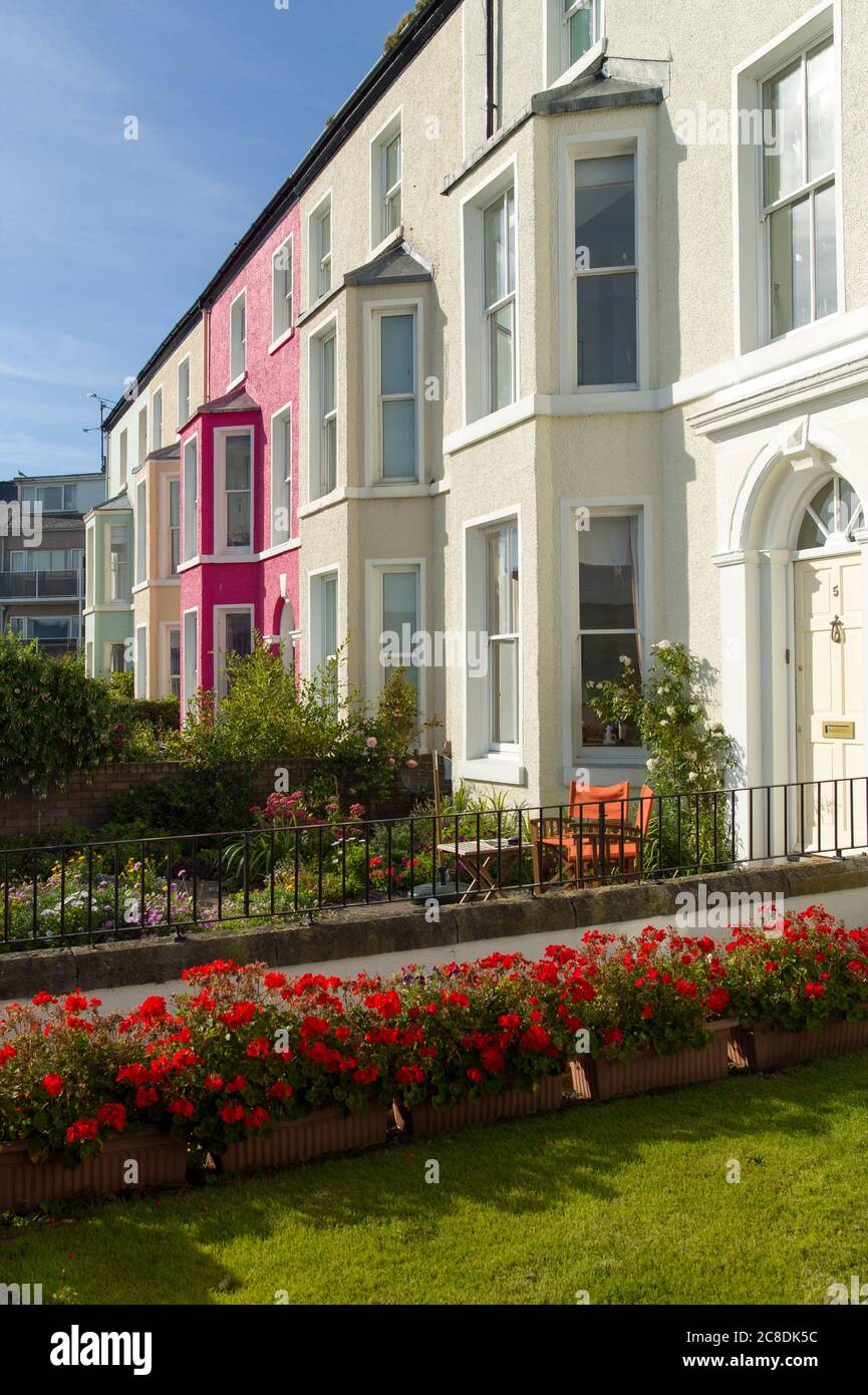 Small front gardens are a feature of these fine terraced houses in Beaumaris Anglesey, North Wales, UK Stock Photo