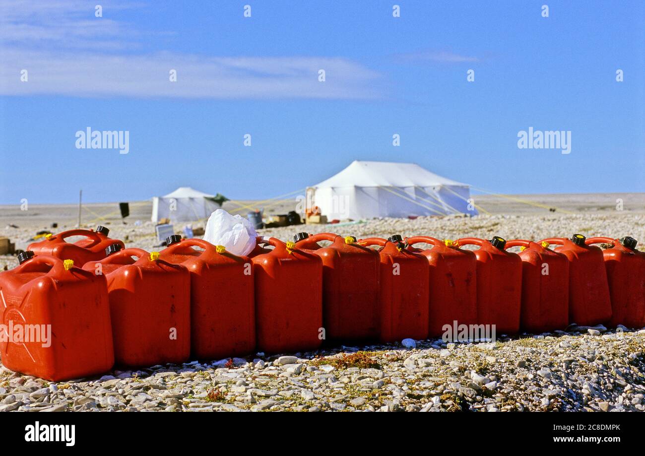 Jerrycans with Inuit tent on Mansel Island, Hudson bay, Nunavut, Canada Stock Photo
