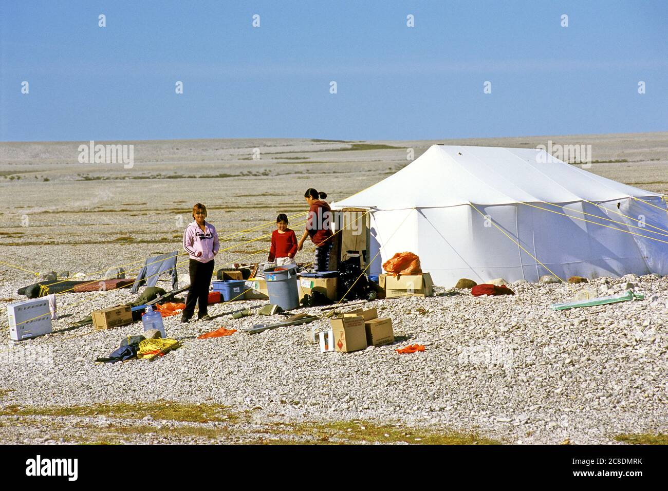 Inuit hunter family standing in front of their tent on Mansel Island, Hudson bay, Nunavut, Canada Stock Photo