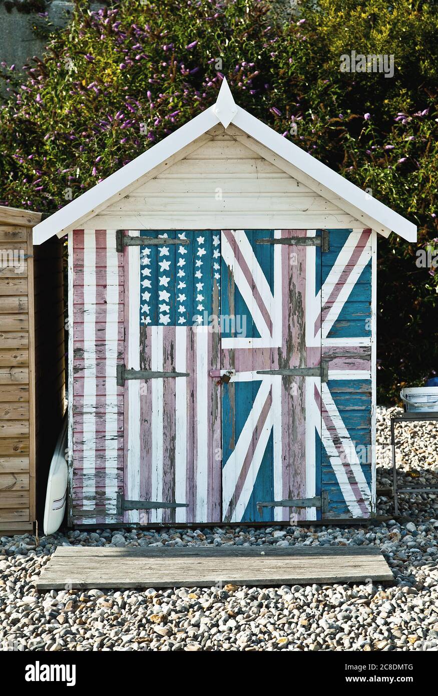 US and UK flag on a beach hut Stock Photo