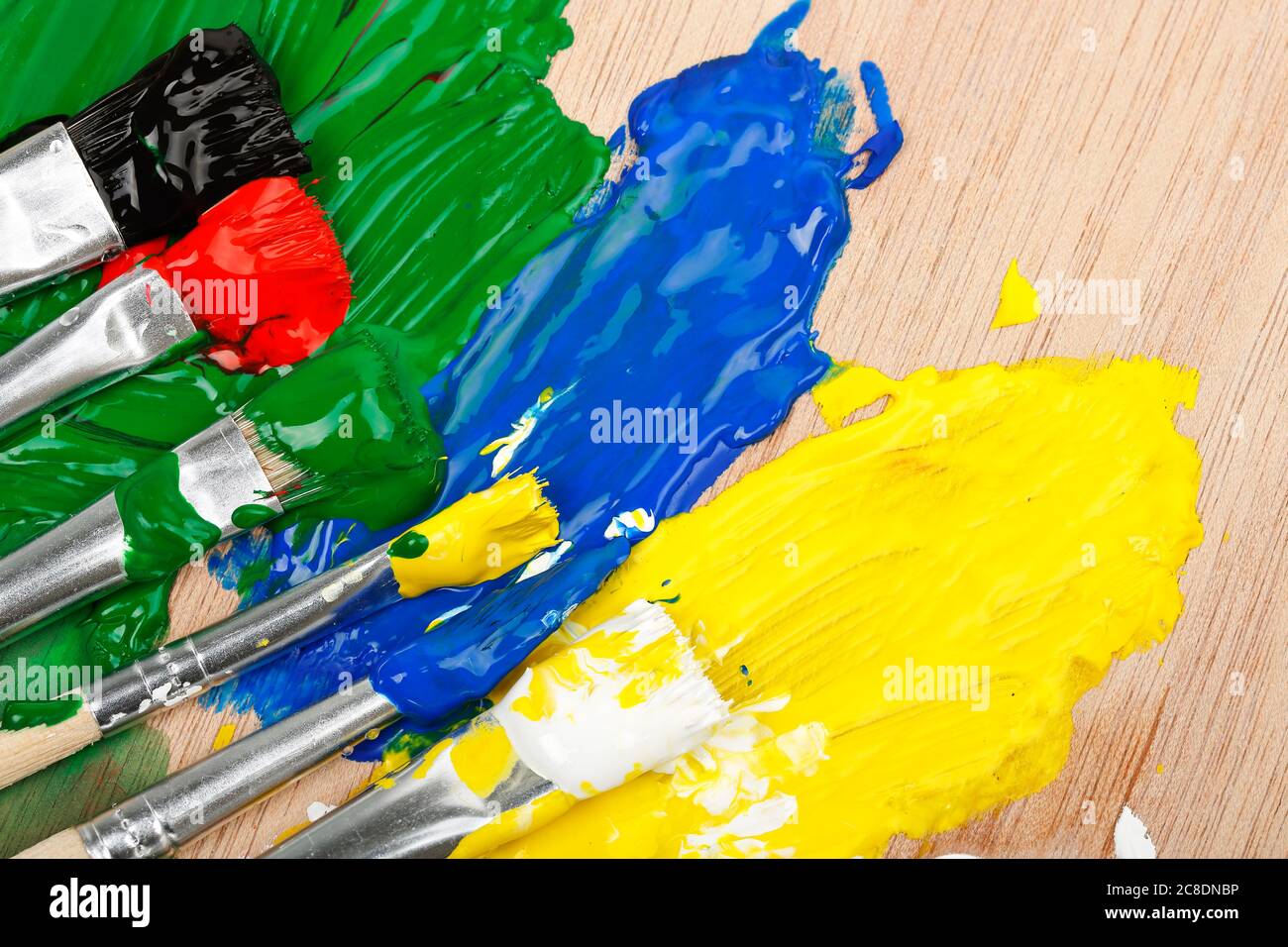 paint brushes with paint on palette Stock Photo Alamy