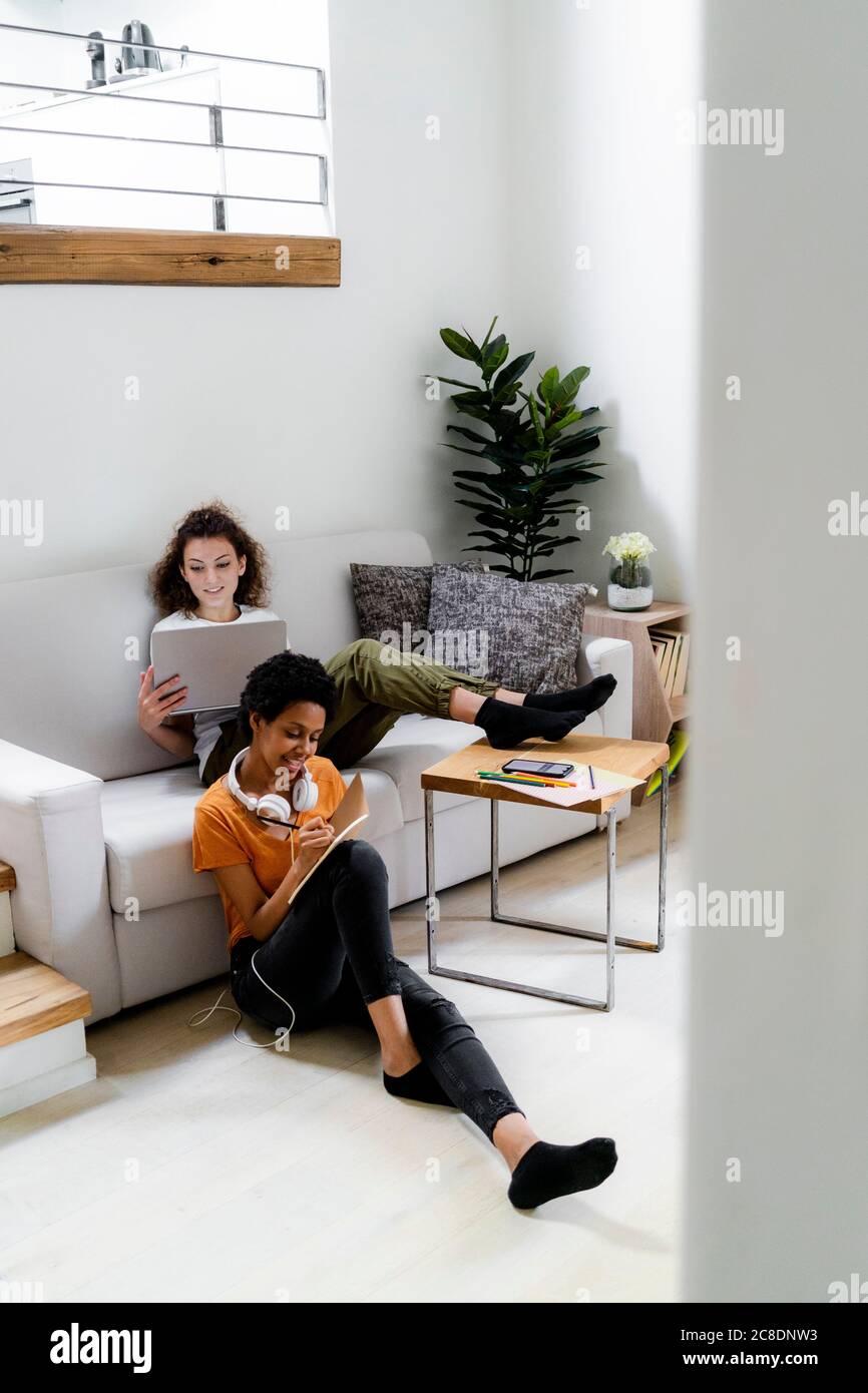 Two students working learning at home Stock Photo