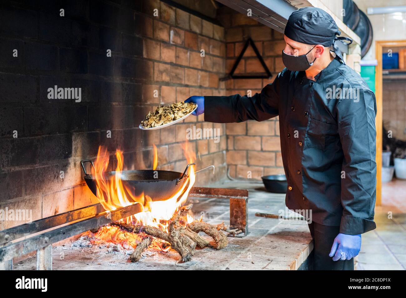 Traditional cooking of spanish food in restaurant kitchen Stock Photo