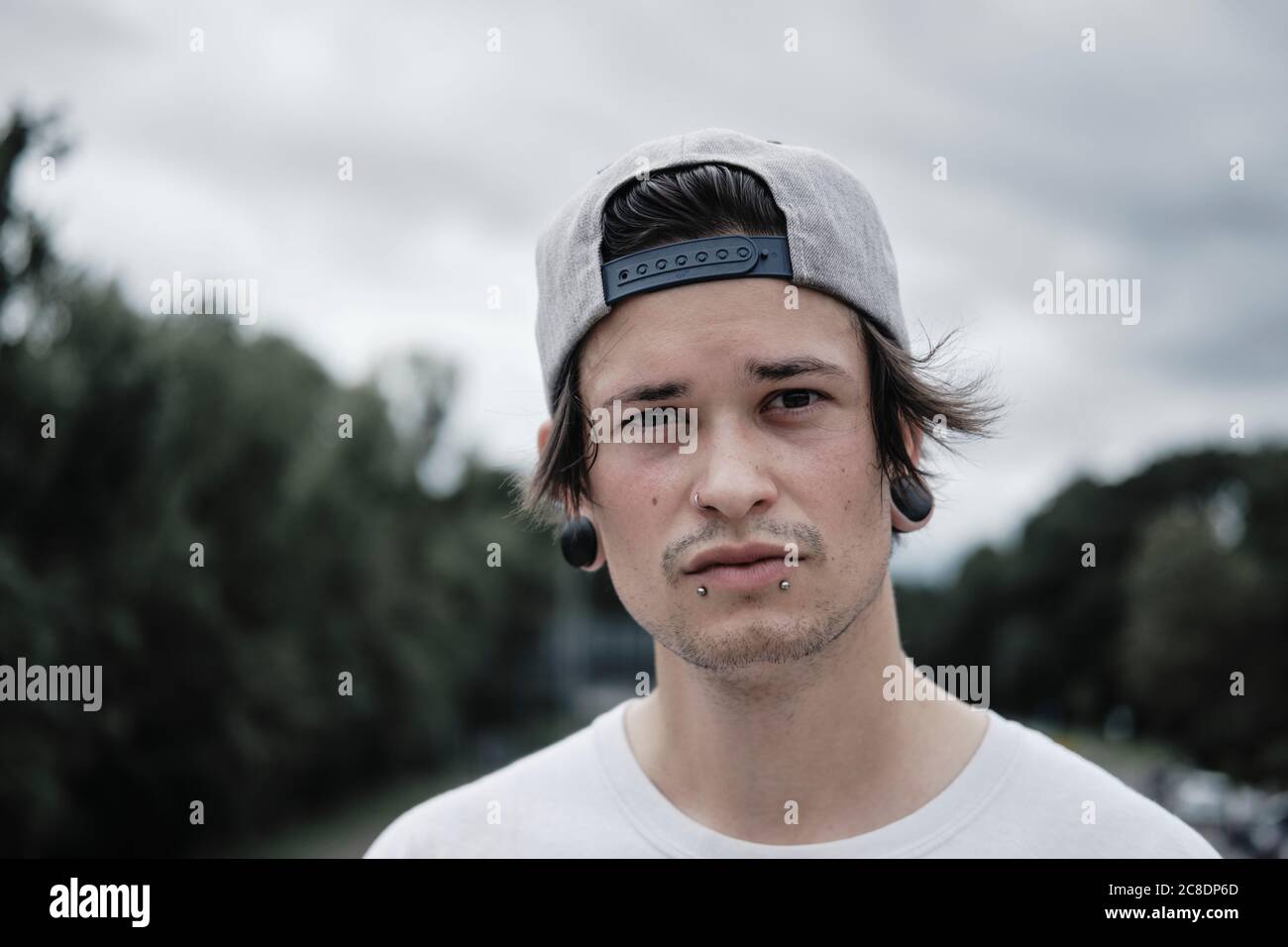 Young man with lip piercing hi-res stock photography and images - Alamy