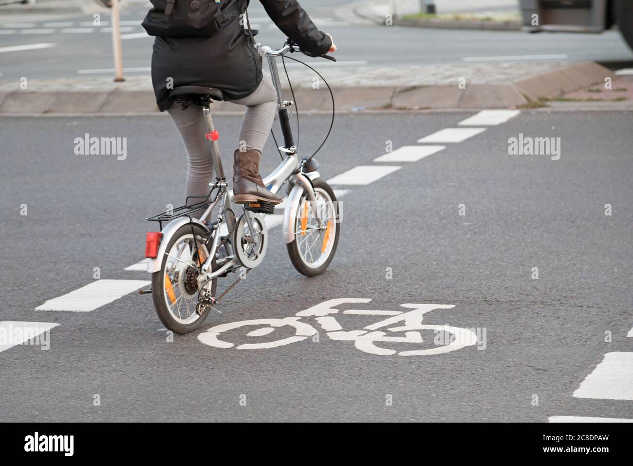 folding bike on cycle lane Stock Photo