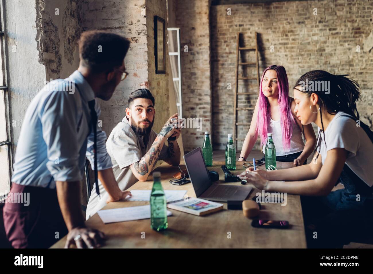 Creative team having business meeting in loft office Stock Photo