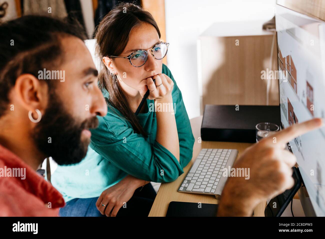 Young architects couple working at home Stock Photo