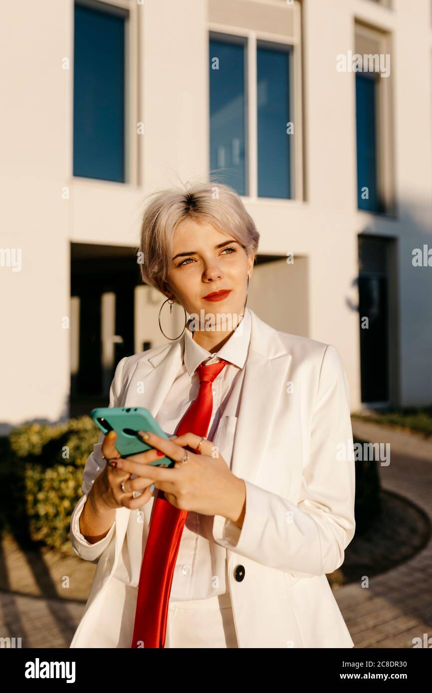 Young woman in white suit hi-res stock photography and images - Alamy