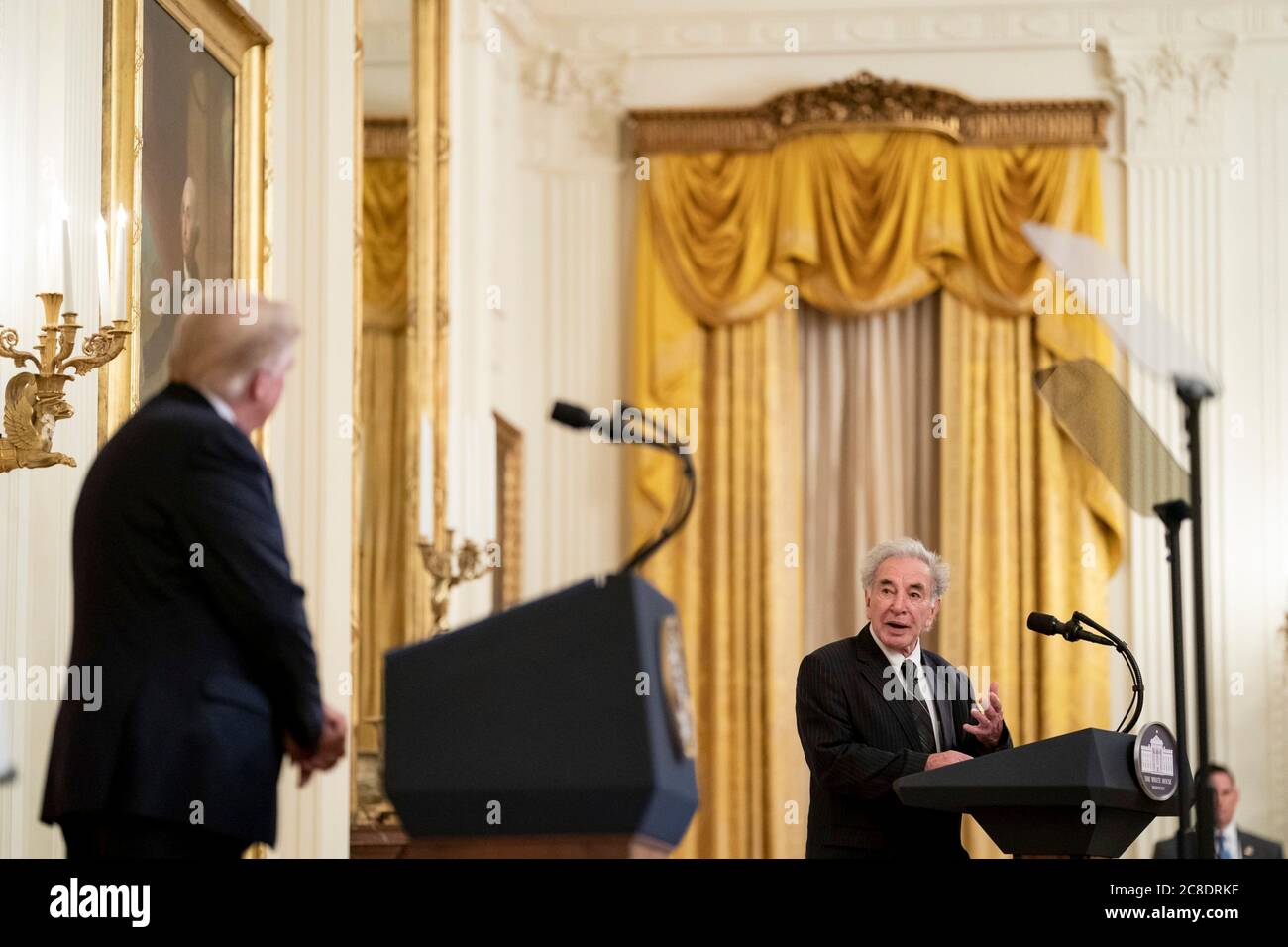 Washington, United States Of America. 22nd July, 2020. Washington, United States of America. 22 July, 2020. U.S. President Donald Trump listens as Sam Vigil talks about the murder of his wife during the announcement of Operation Legend, to combat violent crime in the East Room of the White House July 22, 2020 in Washington, DC Trump plans to send federal law enforcement to cities around the country in what is widely viewed as an attempt to suppress Black Lives Matter protests. Credit: Tia Dufour/White House Photo/Alamy Live News Stock Photo