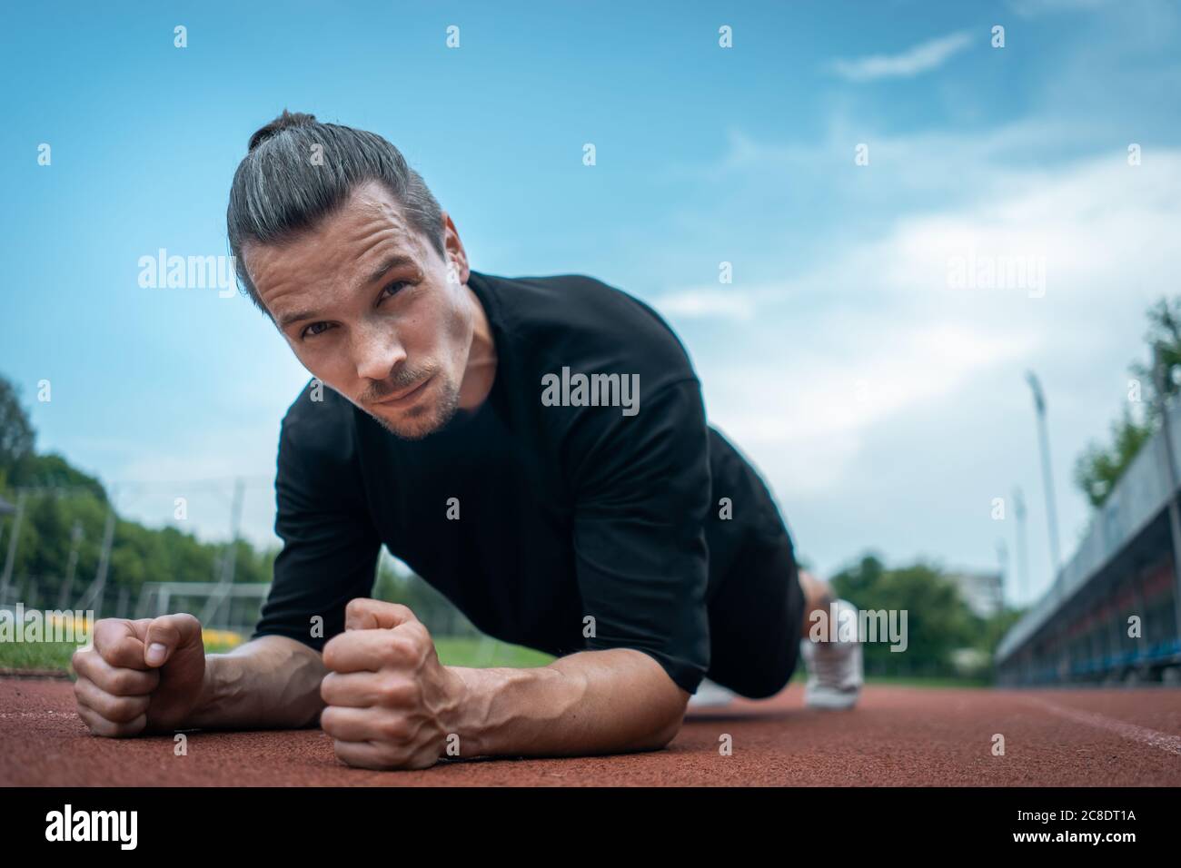 young athlete push up and plank at stadium outdoor Stock Photo - Alamy