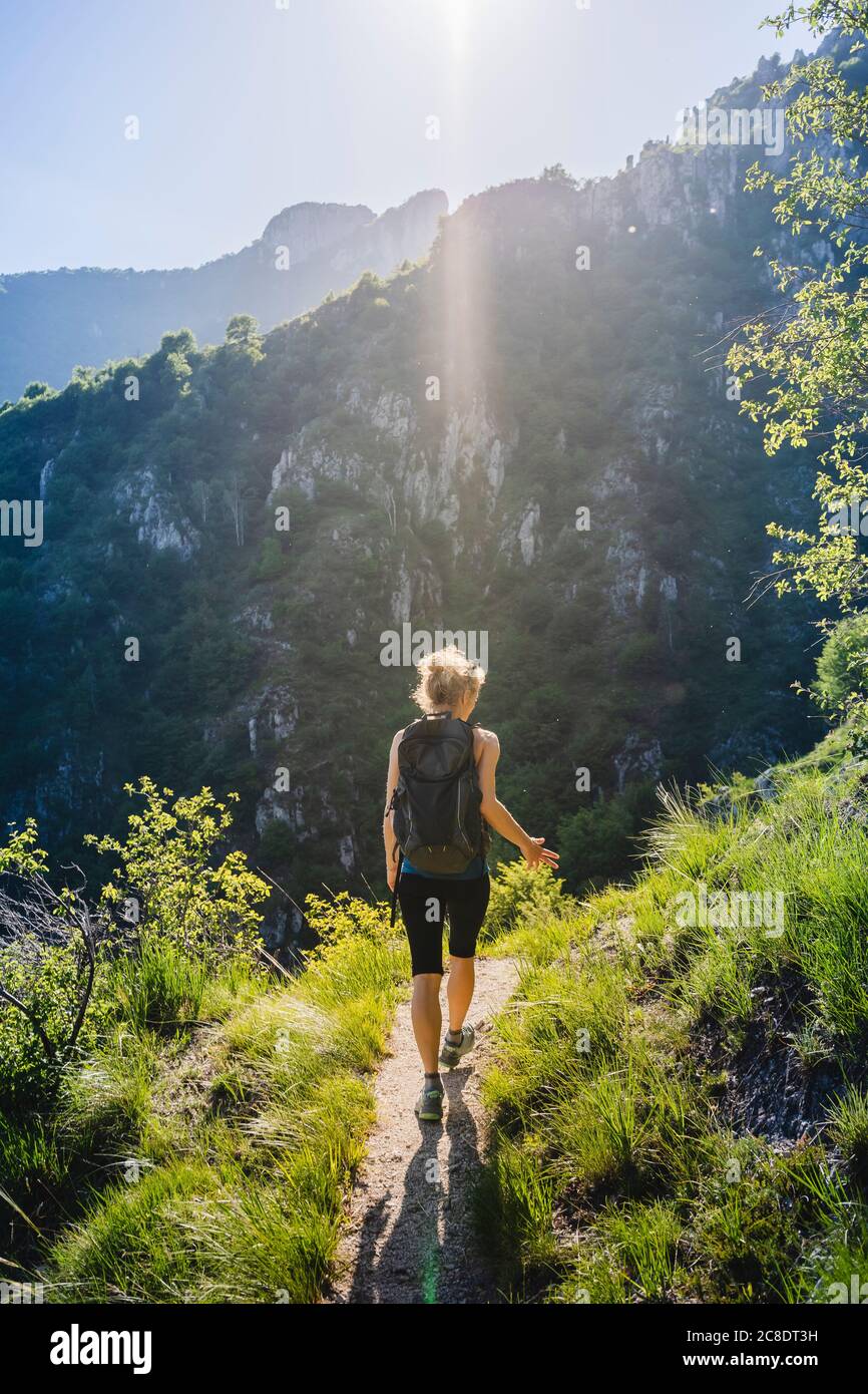 Mature woman hiking on trail hi-res stock photography and images - Alamy