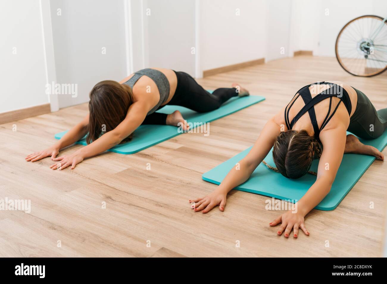Two fit women bending over hi-res stock photography and images - Alamy