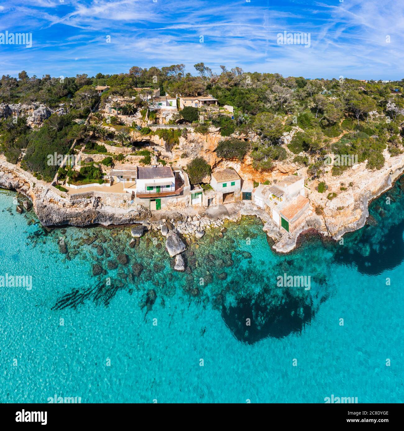 Spain, Mallorca, Santanyi, Drone view of boathouses on rocky coast of  Mallorca Stock Photo - Alamy