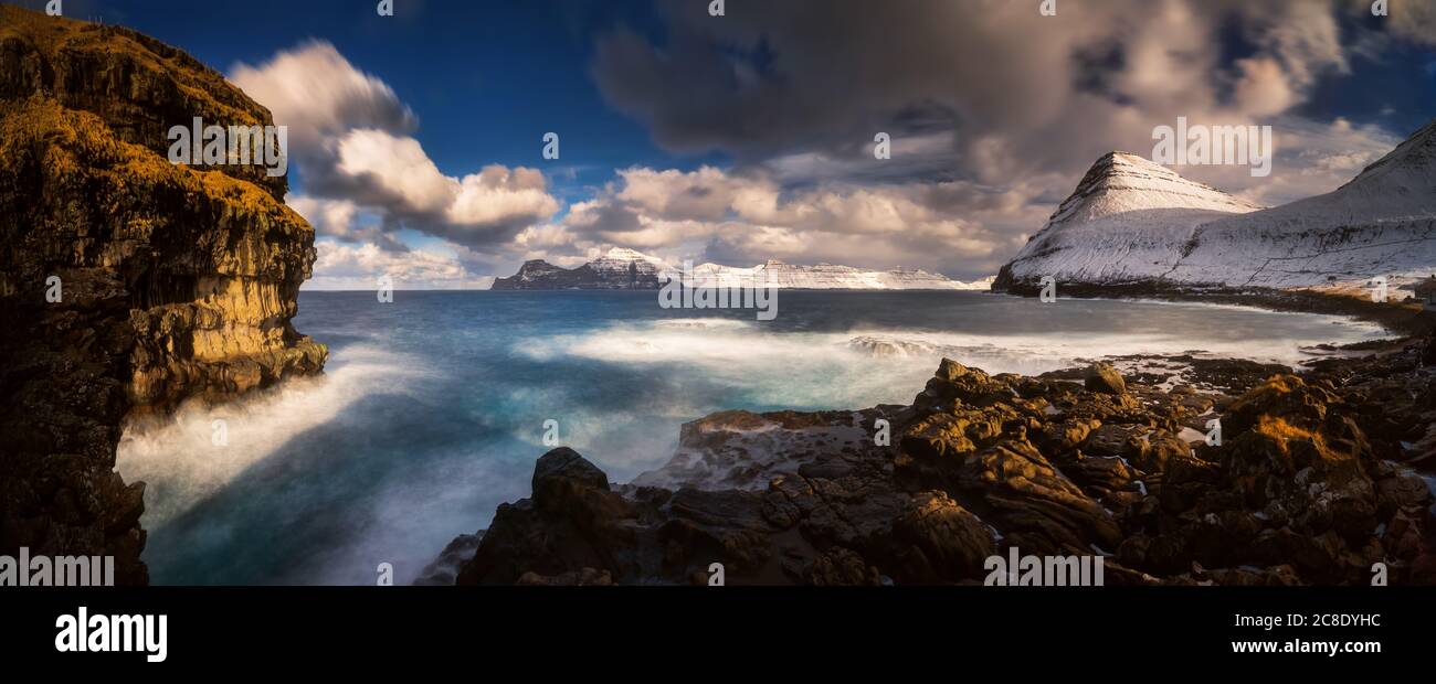Gjogv village coastline with Kalsoy island in background, Faroe Islands Stock Photo