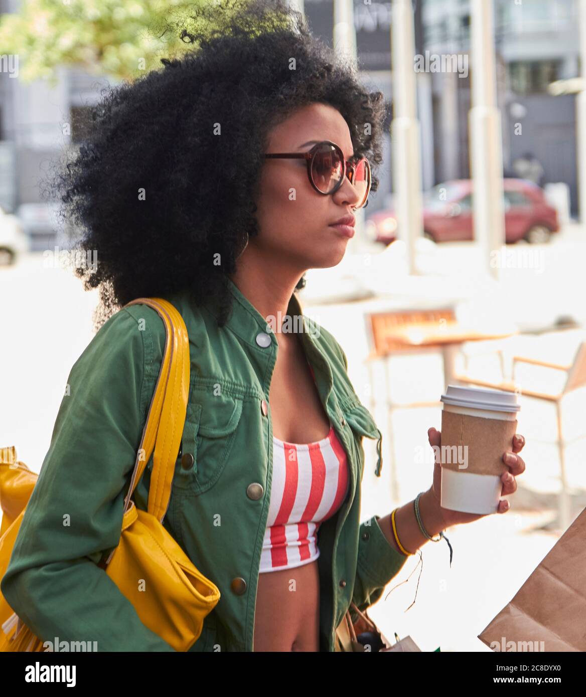 Girlfriends with coffee to go in cafe Stock Photo