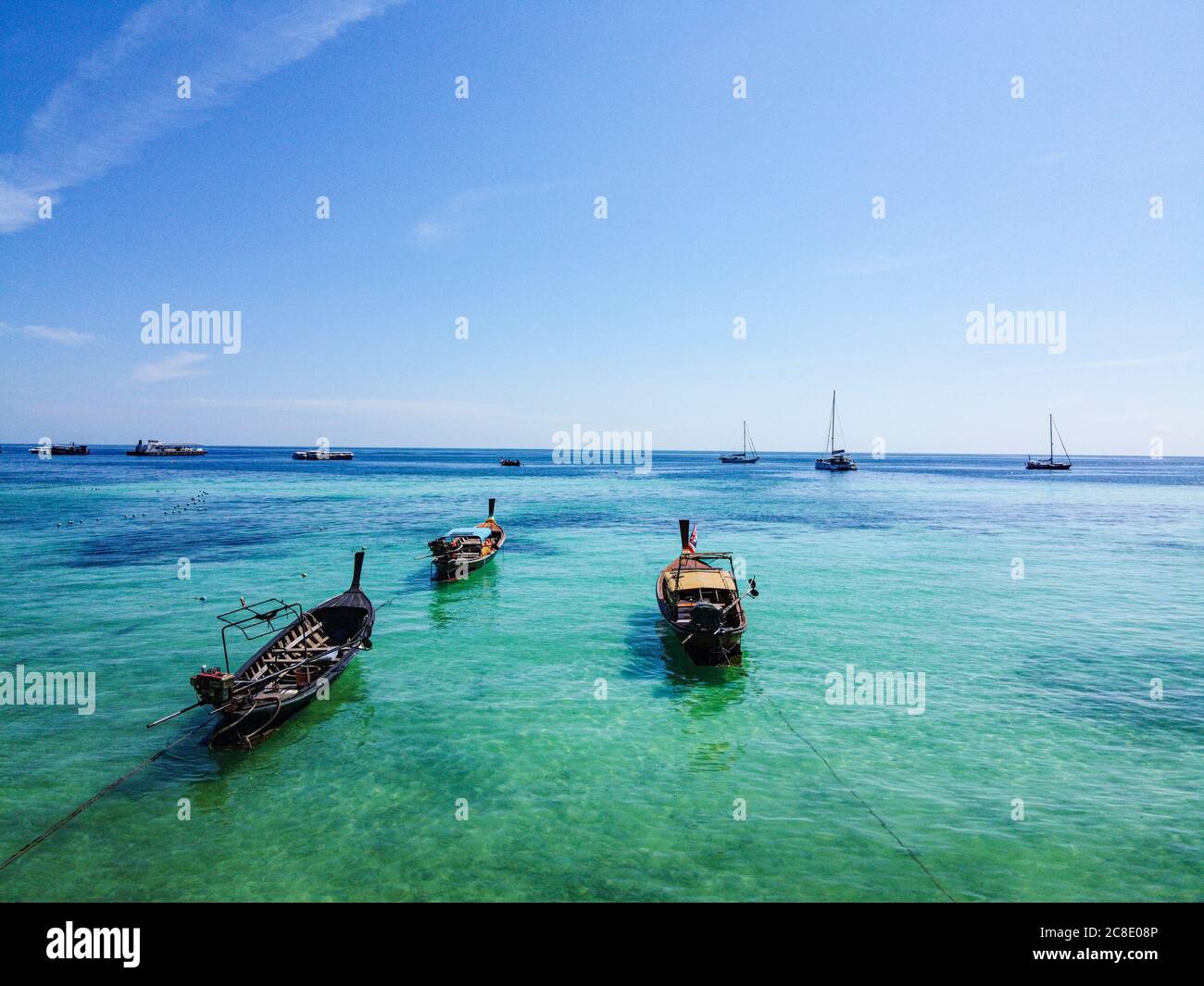 Thailand, Satun Province, Ko Lipe, Fishing boats moored by shore Stock Photo