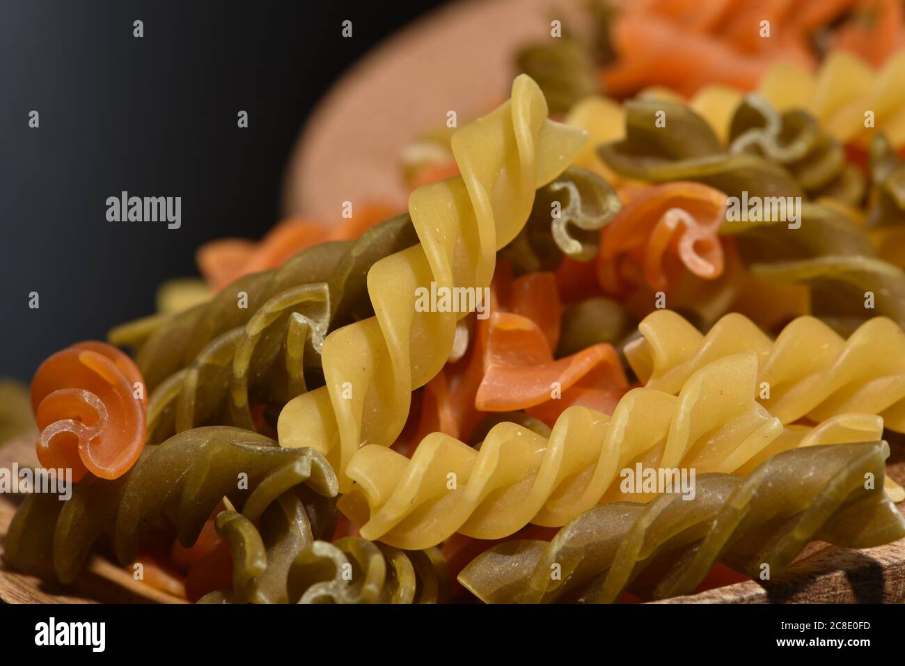 Three Colors Rotini Pasta. Twisted colored pasta in Italy Stock Photo