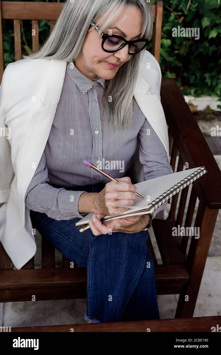 Female sitting in chair hi-res stock photography and images - Alamy
