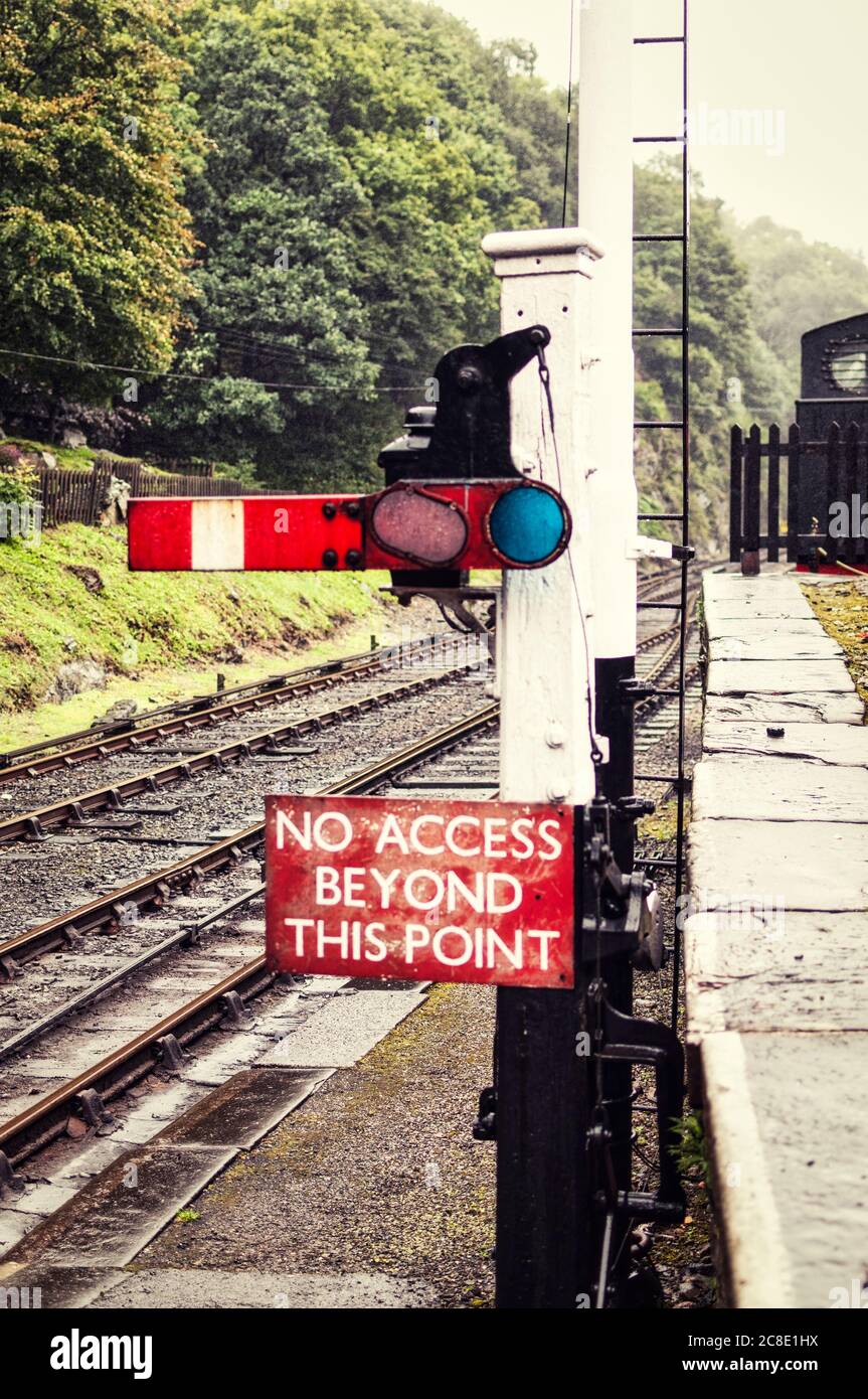 Old steam railway semaphore signal in the stop position. Upper quadrant signal. Stock Photo