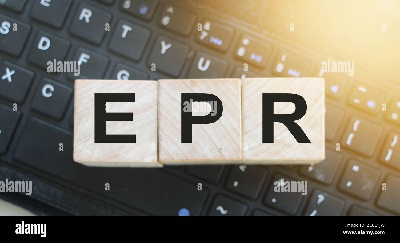 ERP Enterprise Resource Planning on wood cubes on computer keyboard. Stock Photo