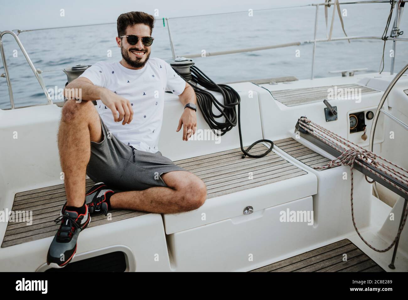 Young man sitting in boat hi-res stock photography and images - Alamy