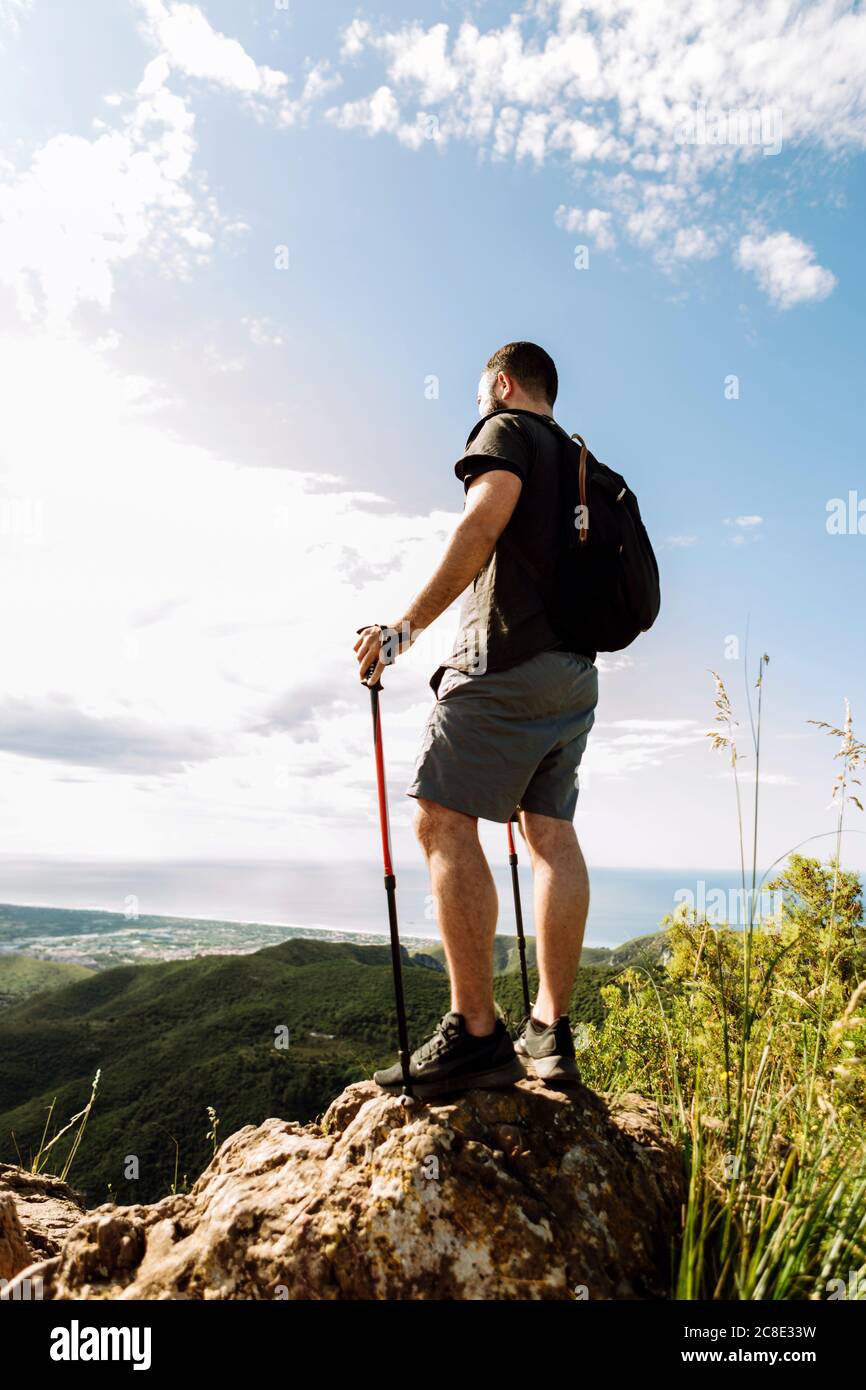 Hiker at the top of a mountain Stock Photo