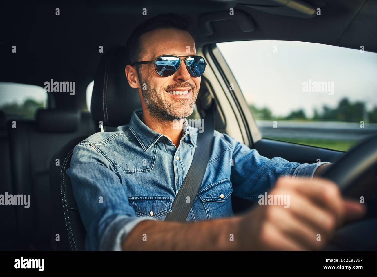 Man driving a car and glasses hi-res stock photography and images