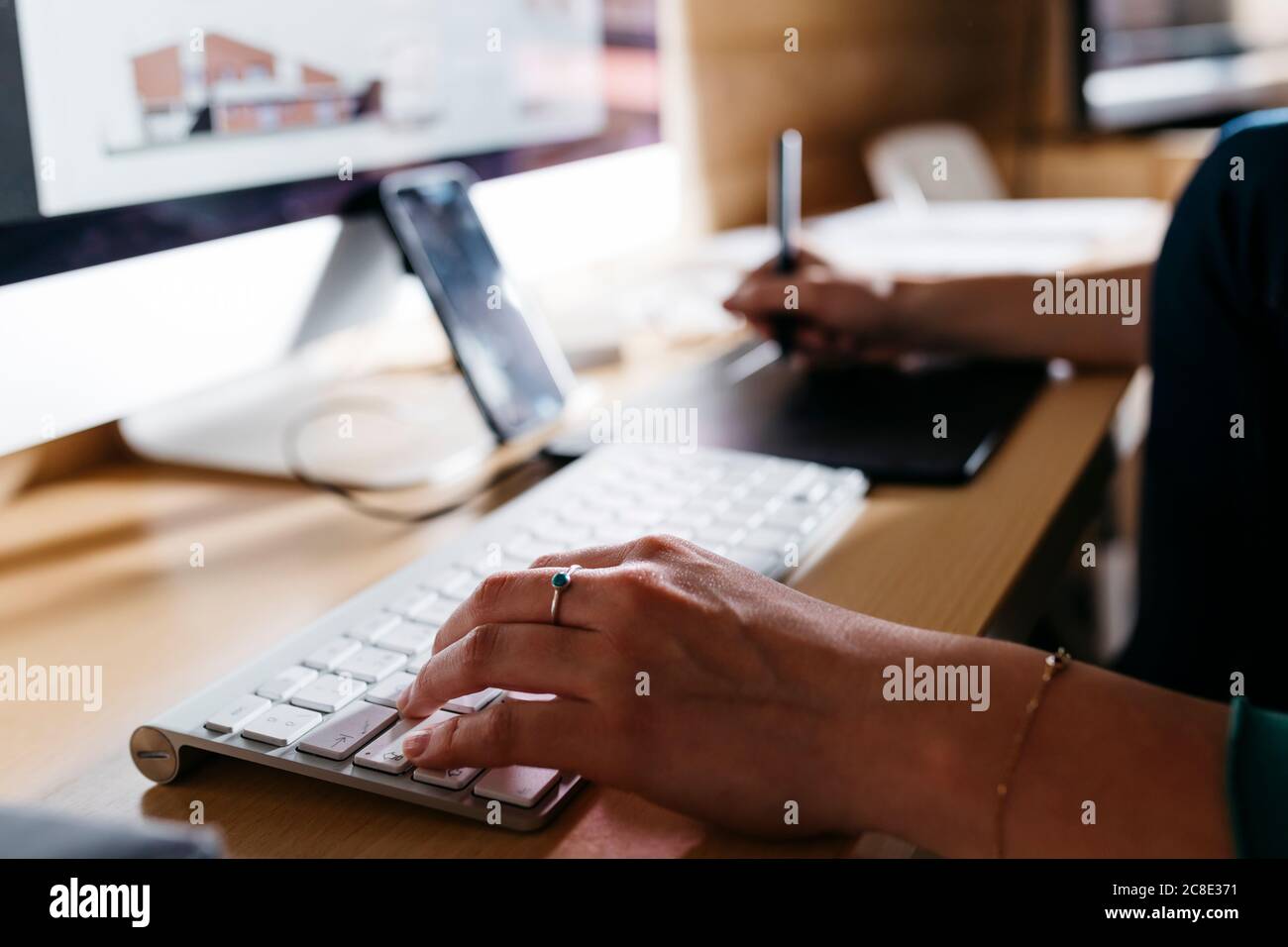 Female architect using computer at home Stock Photo