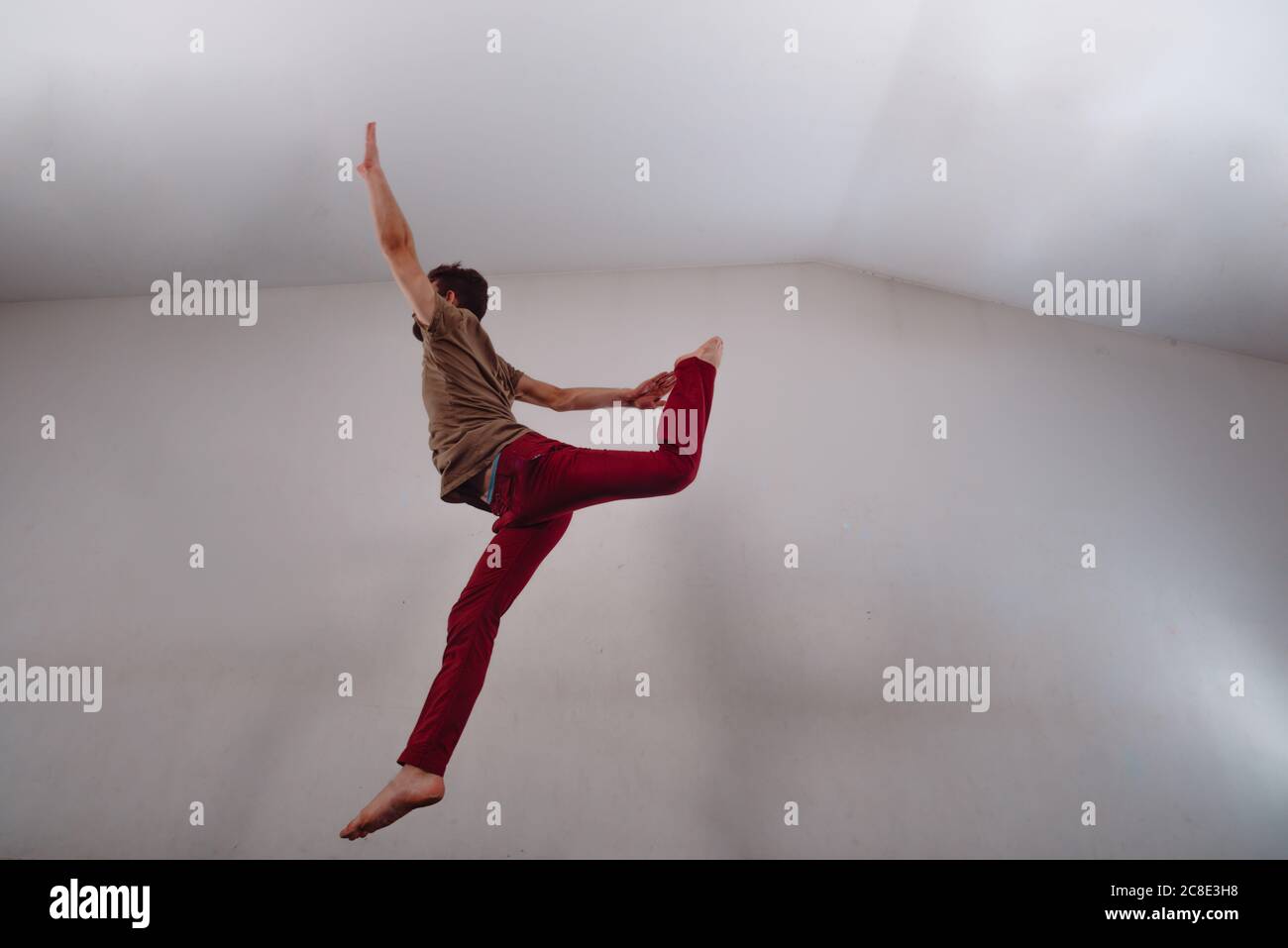 Artistic modern dancer practicing dancing moves in the studio Stock Photo