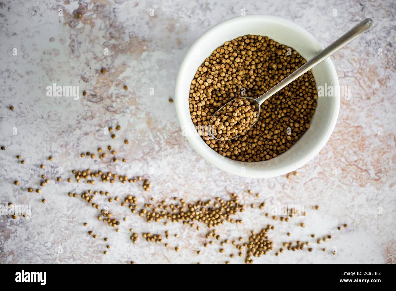 Bowl of coriander seeds Stock Photo