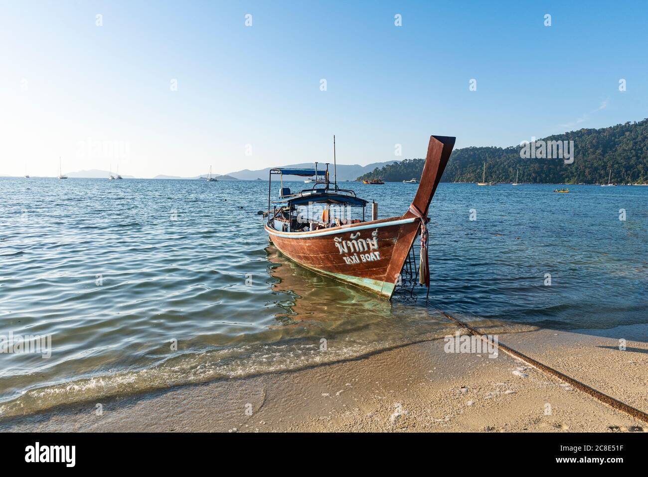 Thailand, Satun Province, Ko Lipe, Fishing boat moored at shore of coastal beach Stock Photo