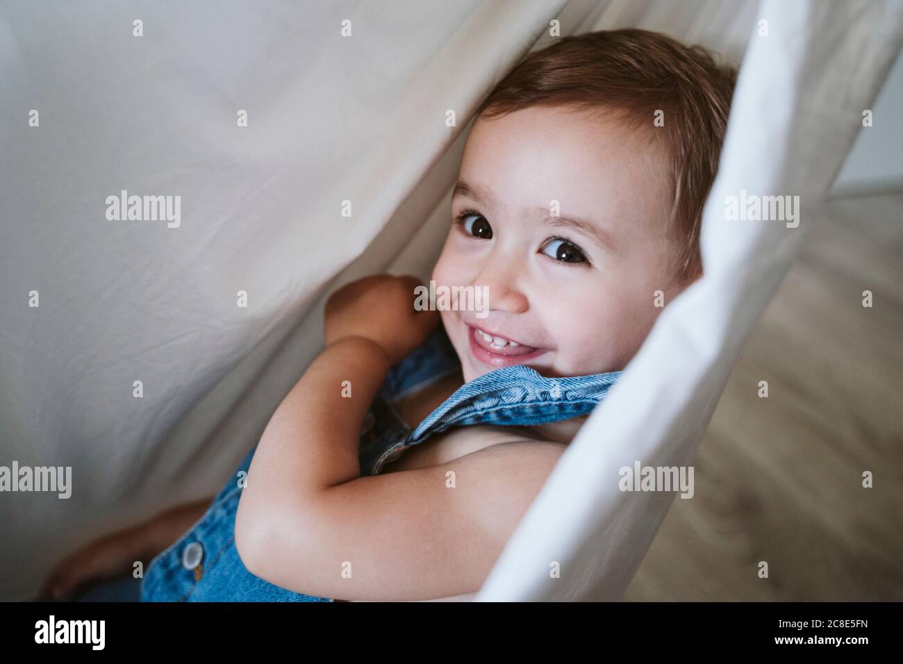 Baby girl on hammock at home Stock Photo