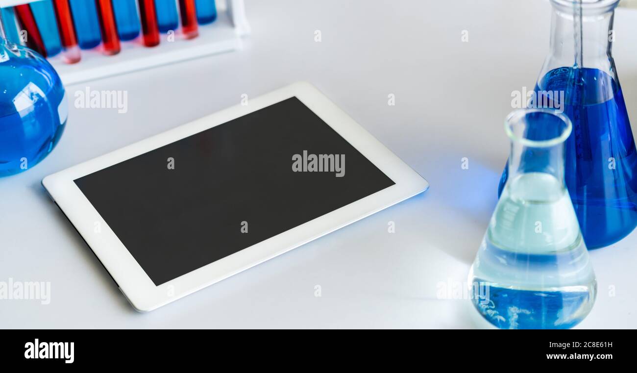 Tablet computer in chemistry laboratory. Stock Photo