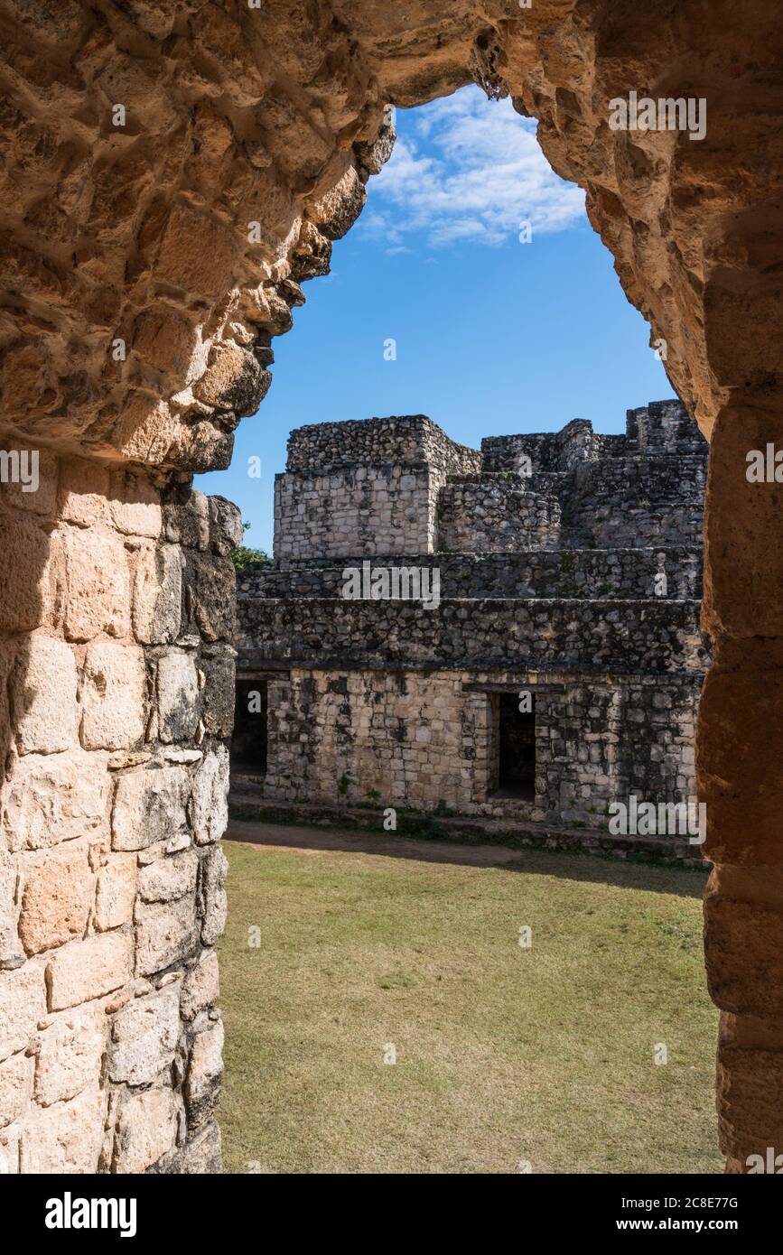 The Entrance Arch in the ruins of the pre-Hispanic Mayan city of Ek Balam in Yucatan, Mexico.  Behind the arch is the Oval Palace. Stock Photo