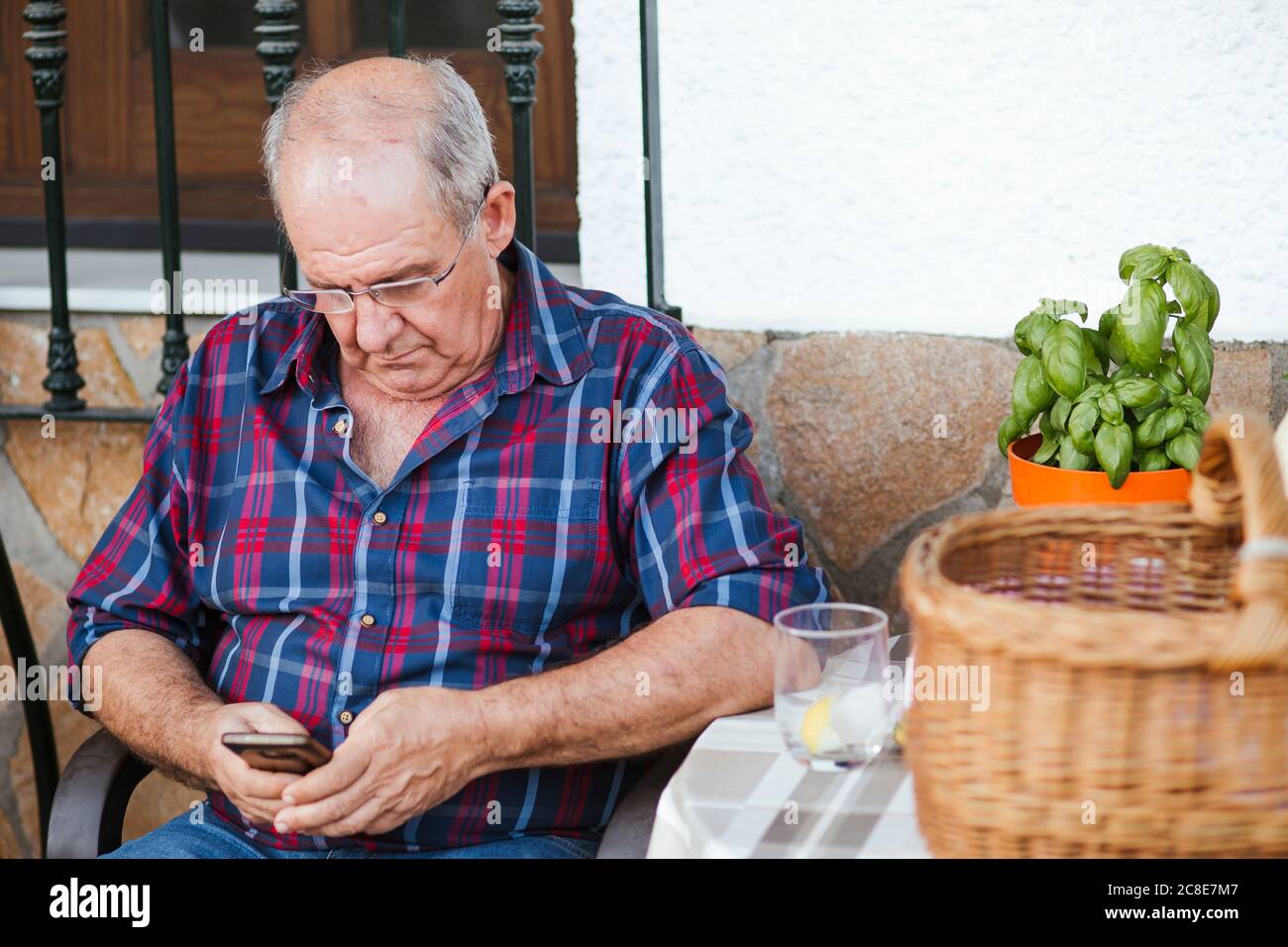 Senior man using smartphone Stock Photo