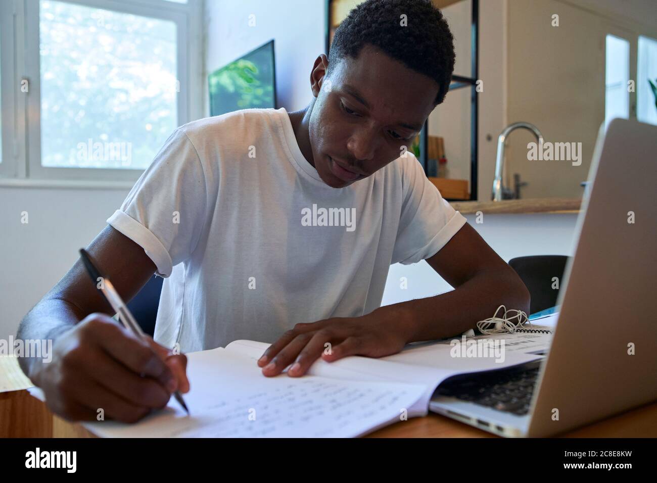 Close up african man writing hi-res stock photography and images - Alamy