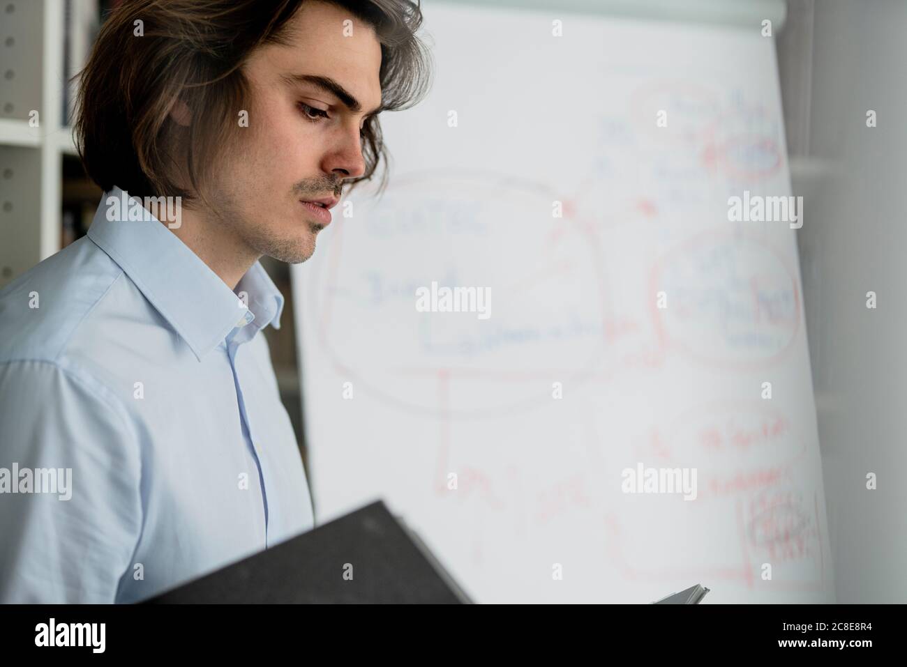 Close-up of businessman analyzing data in office Stock Photo