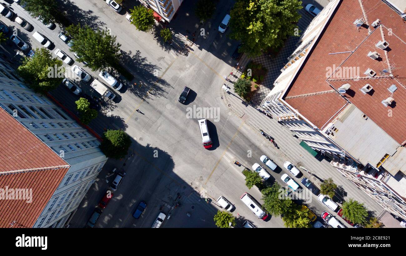 Aerial view of the roundabout at the city center. City roads, buildings and vehicles can be seen. Stock Photo