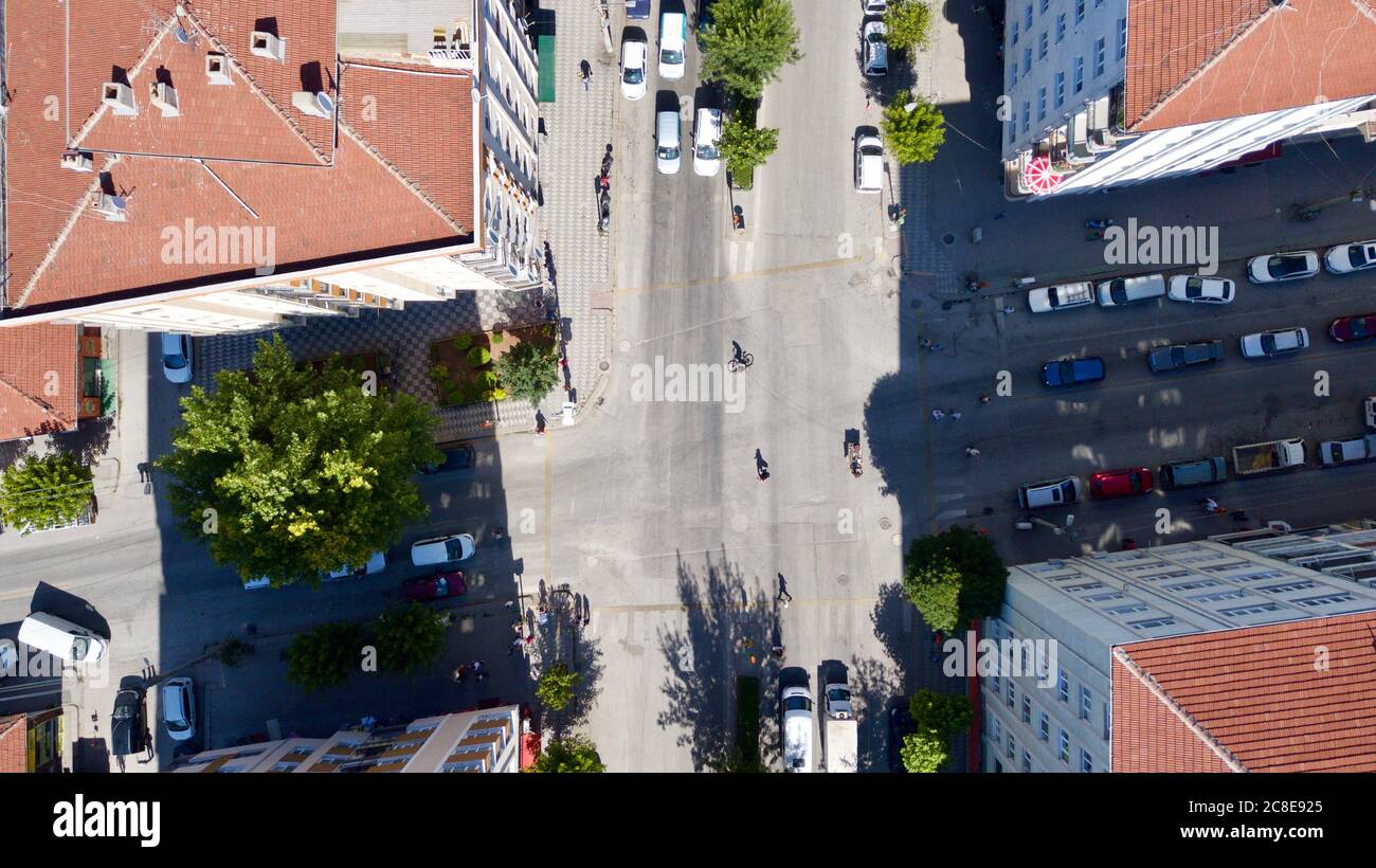 Aerial view of the roundabout at the city center. City roads, buildings and vehicles can be seen. Stock Photo