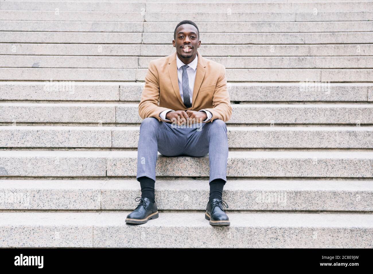 Young people sitting on stairs hi-res stock photography and images - Alamy