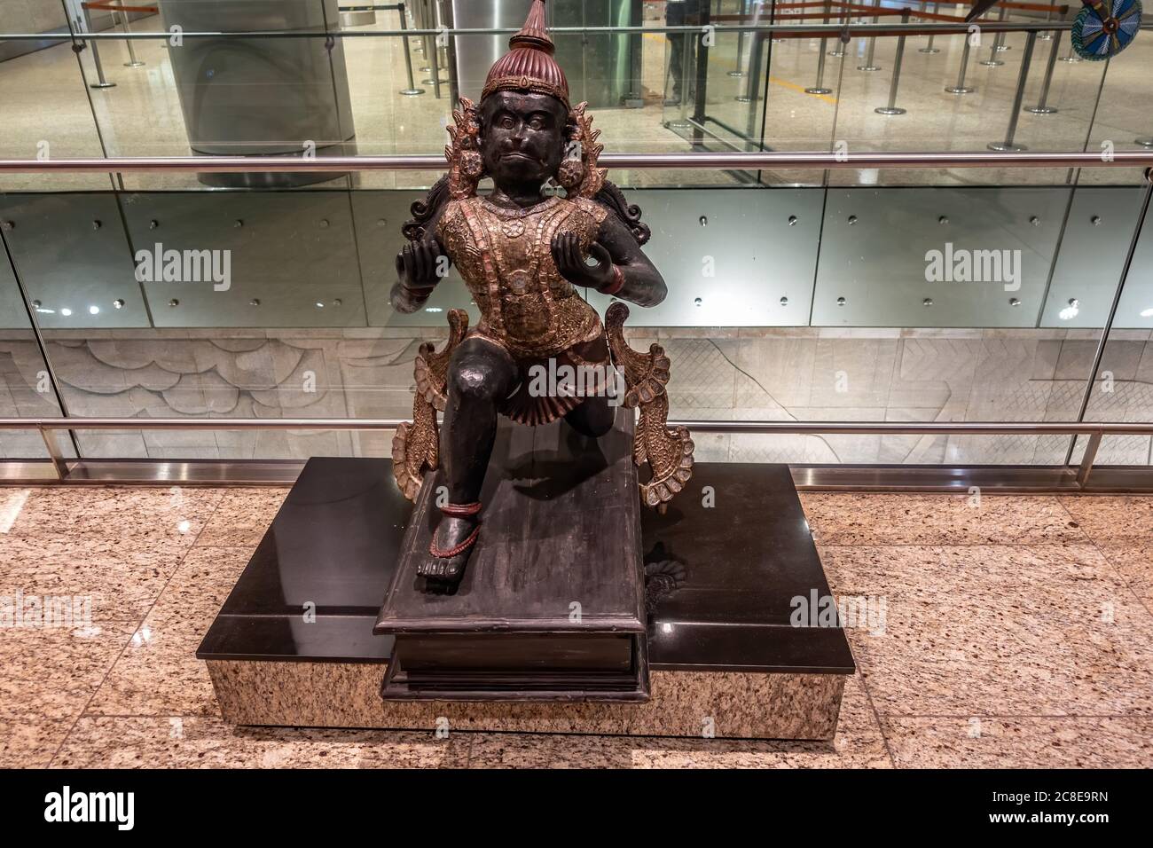 MUMBAI AIRPORT, INDIA DECEMBER 31, 2018: Publicly exhibited antic wooden sculpture of Hanuman, known as the Lord of Celibacy, Supreme evil destroyer Stock Photo