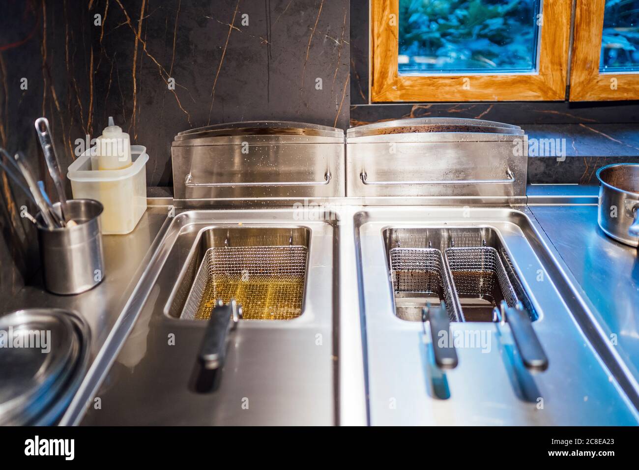 Deep fryer in restaurant kitchen Stock Photo Alamy