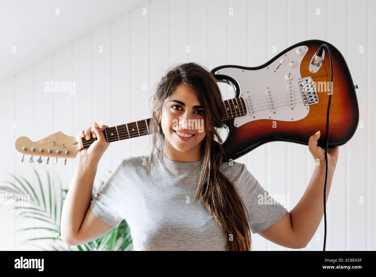 Rock and Roll Man with Guitar on Shoulder Embracing Woman Stock Image -  Image of leather, hold: 99189689